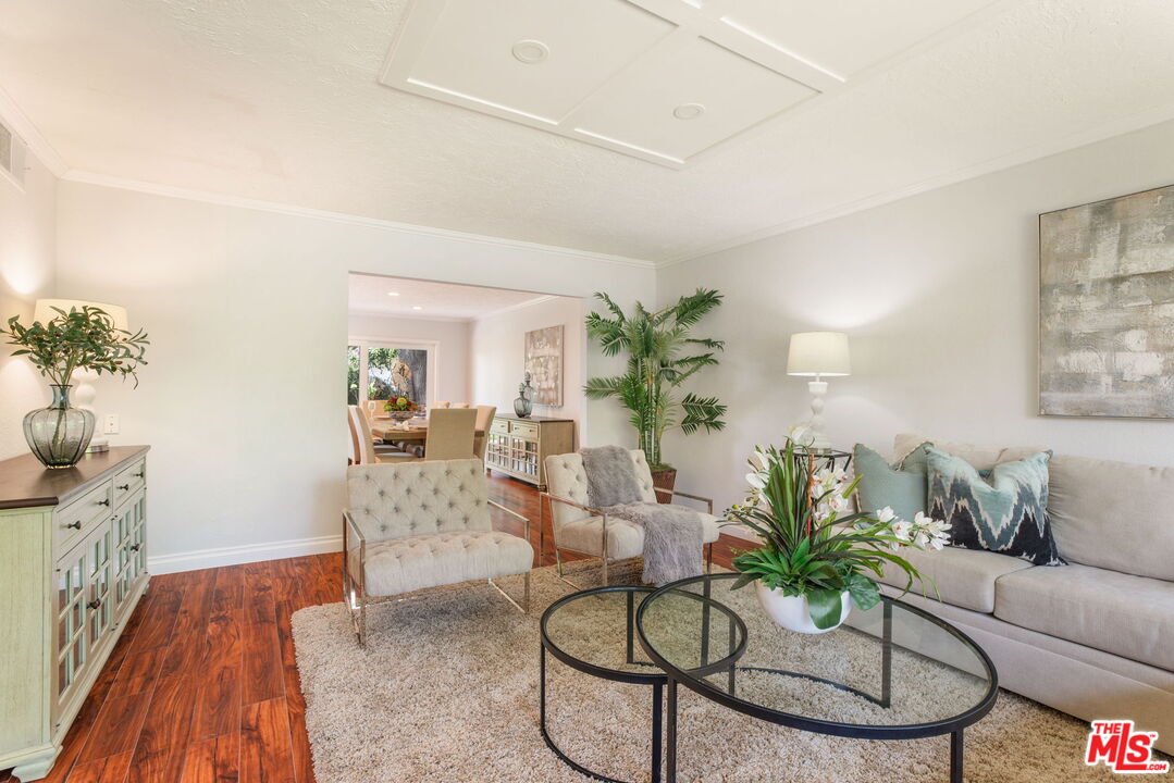 2829 Bottlebrush Drive Los Angeles, CA 90077 - Photo 7 of 40 a living room with furniture potted plant and a chandelier