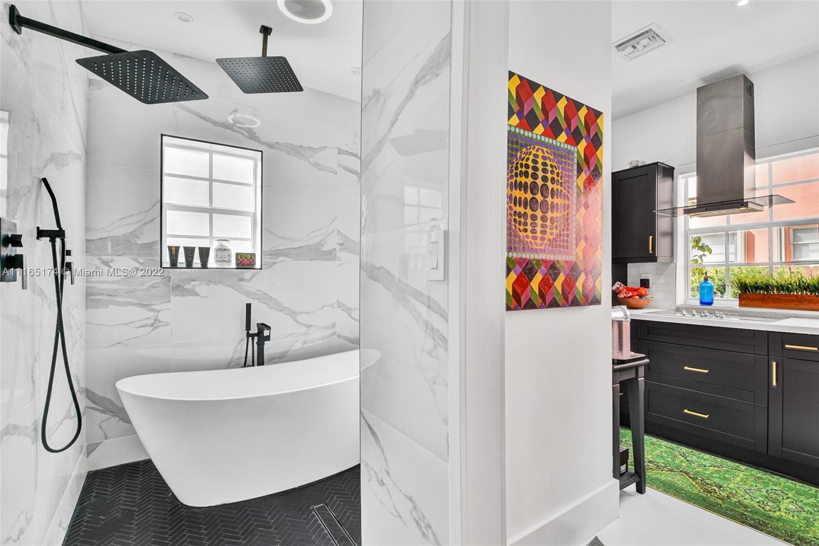4722 Southwest 5th Street Miami, FL 33134 - Photo 17 of 36 a bathroom with a sink and a bathtub