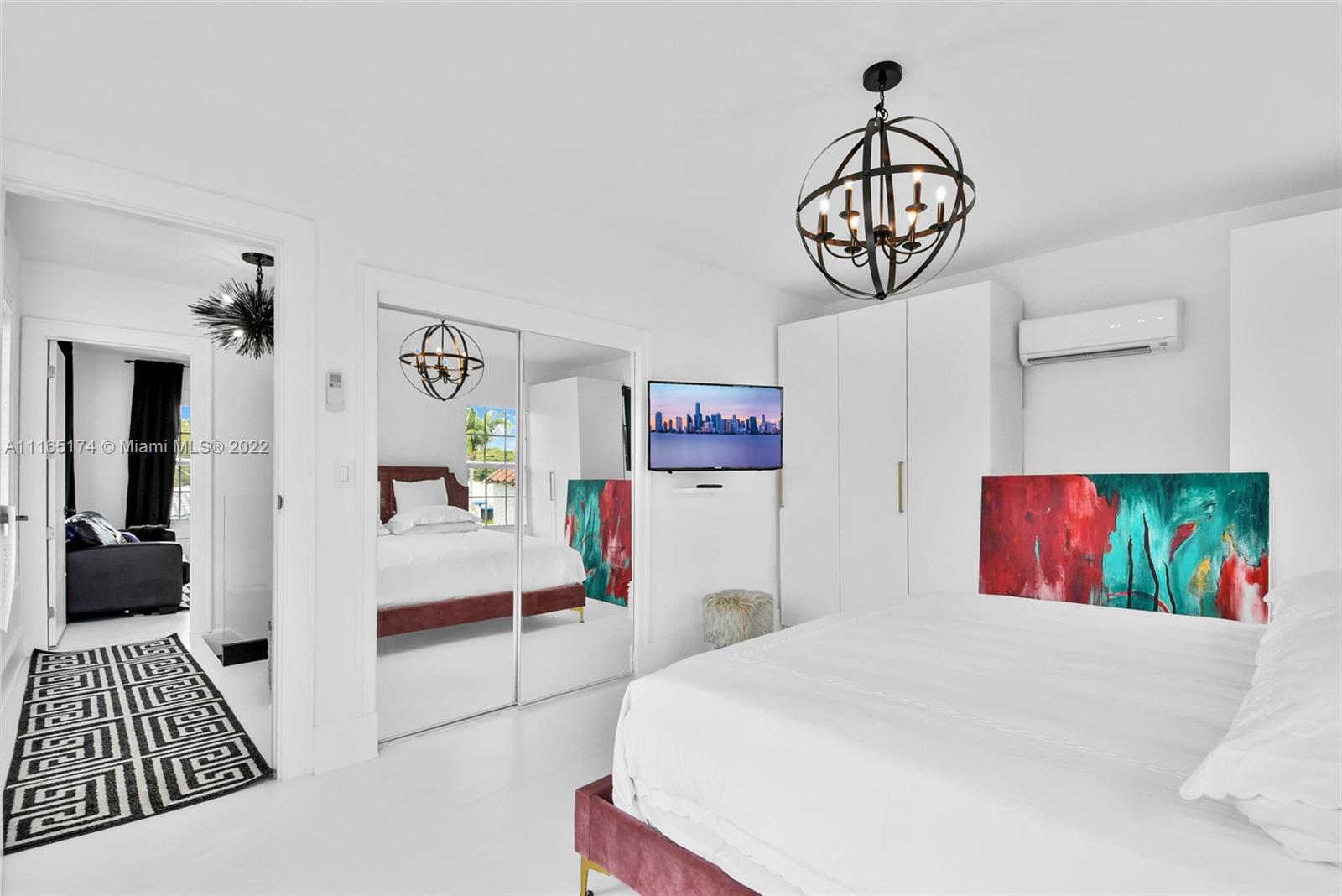 4722 Southwest 5th Street Miami, FL 33134 - Photo 20 of 36 a bedroom with a bed and a chandelier