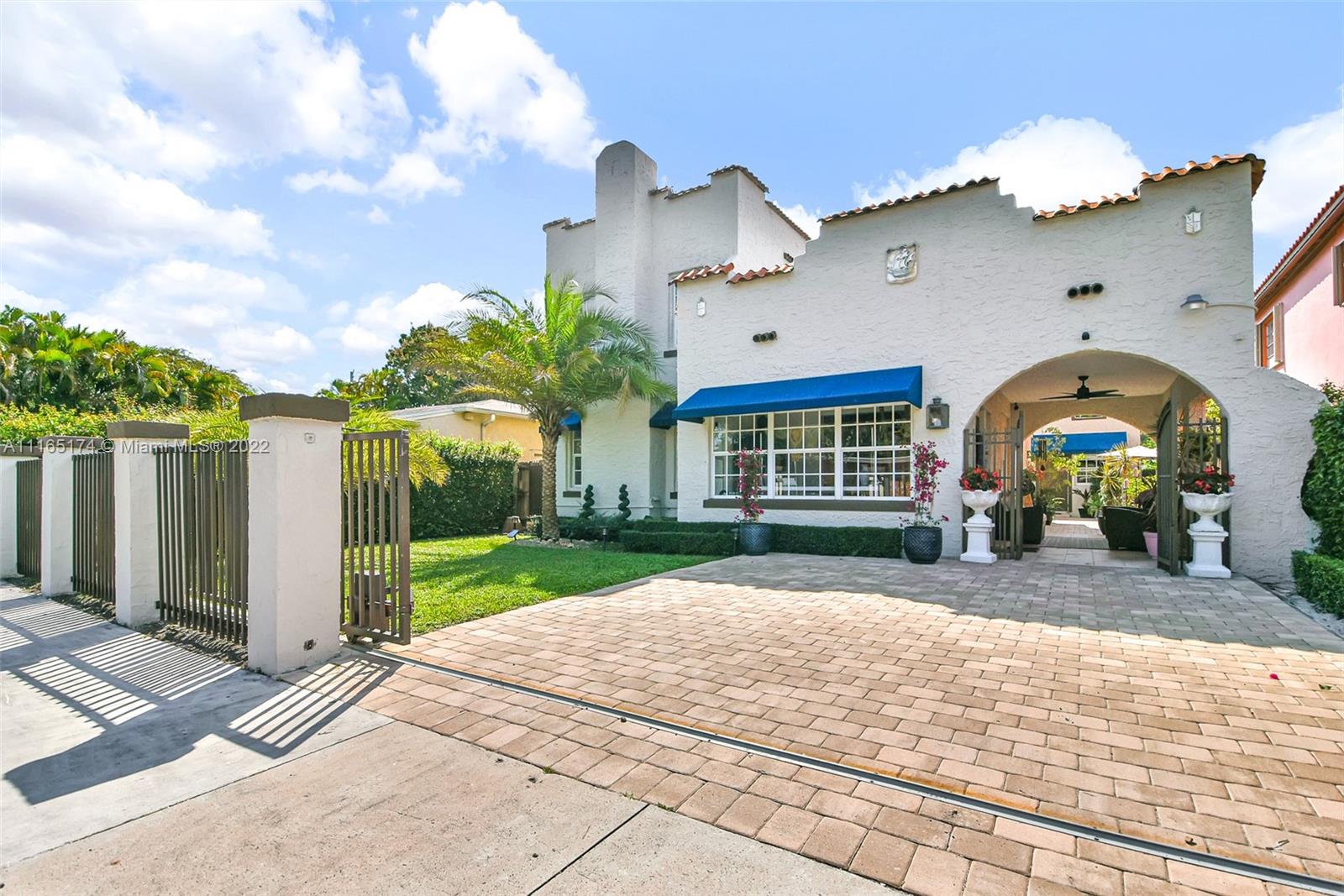 4722 Southwest 5th Street Miami, FL 33134 - Photo 2 of 36 a front view of a house with a yard