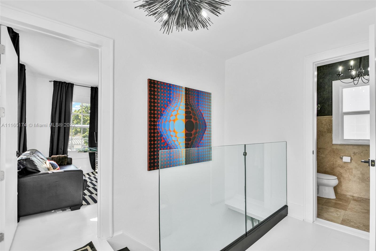 4722 Southwest 5th Street Miami, FL 33134 - Photo 22 of 36 a living room with furniture and a flat screen tv