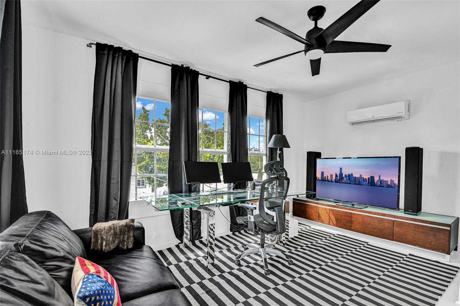4722 Southwest 5th Street Miami, FL 33134 - Photo 24 of 36 a living room with furniture and large windows