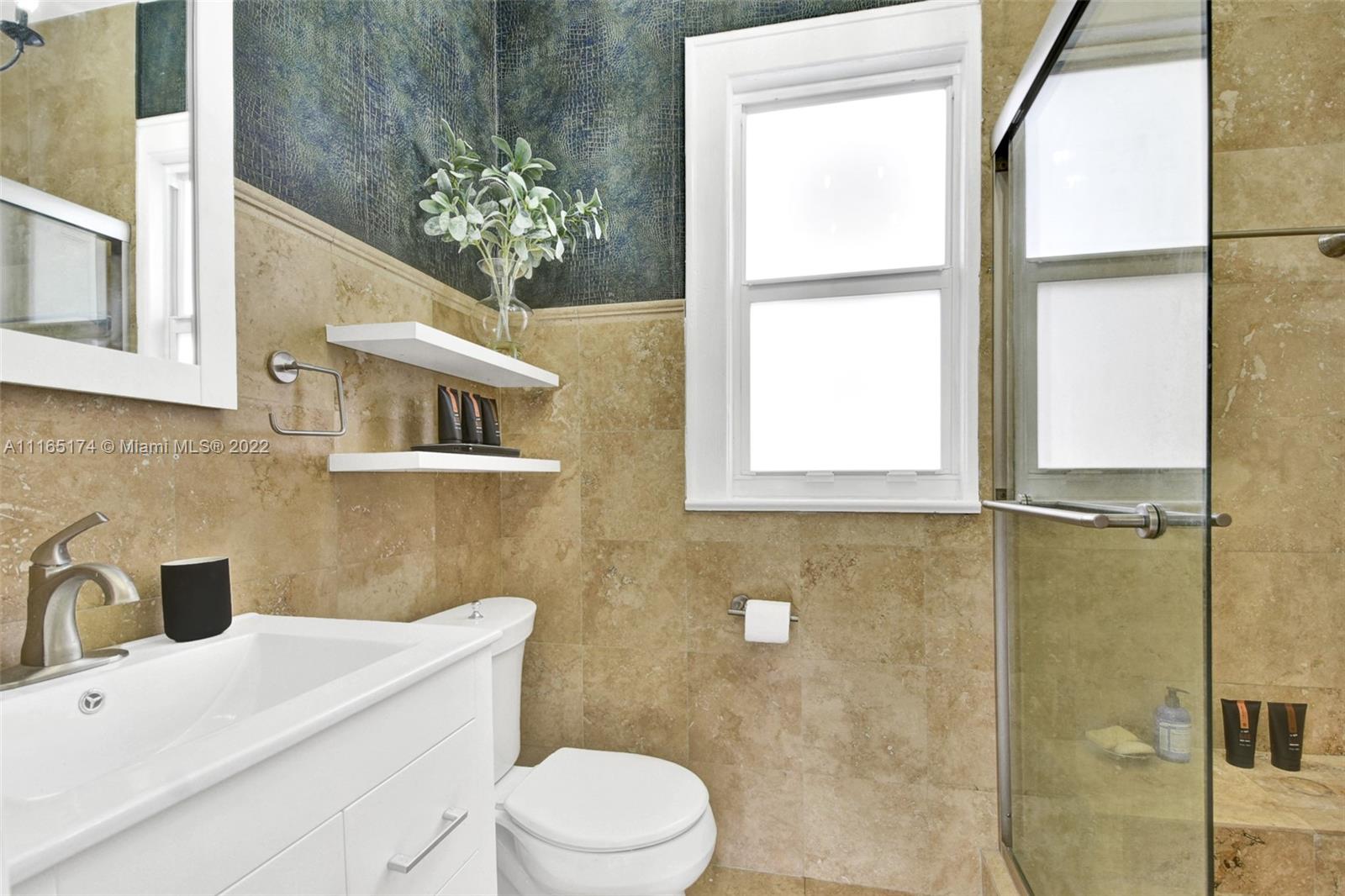 4722 Southwest 5th Street Miami, FL 33134 - Photo 26 of 36 a bathroom with a sink a toilet and shower