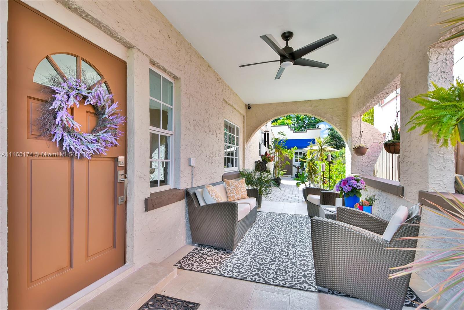 4722 Southwest 5th Street Miami, FL 33134 - Photo 3 of 36 a living room with furniture and a large window