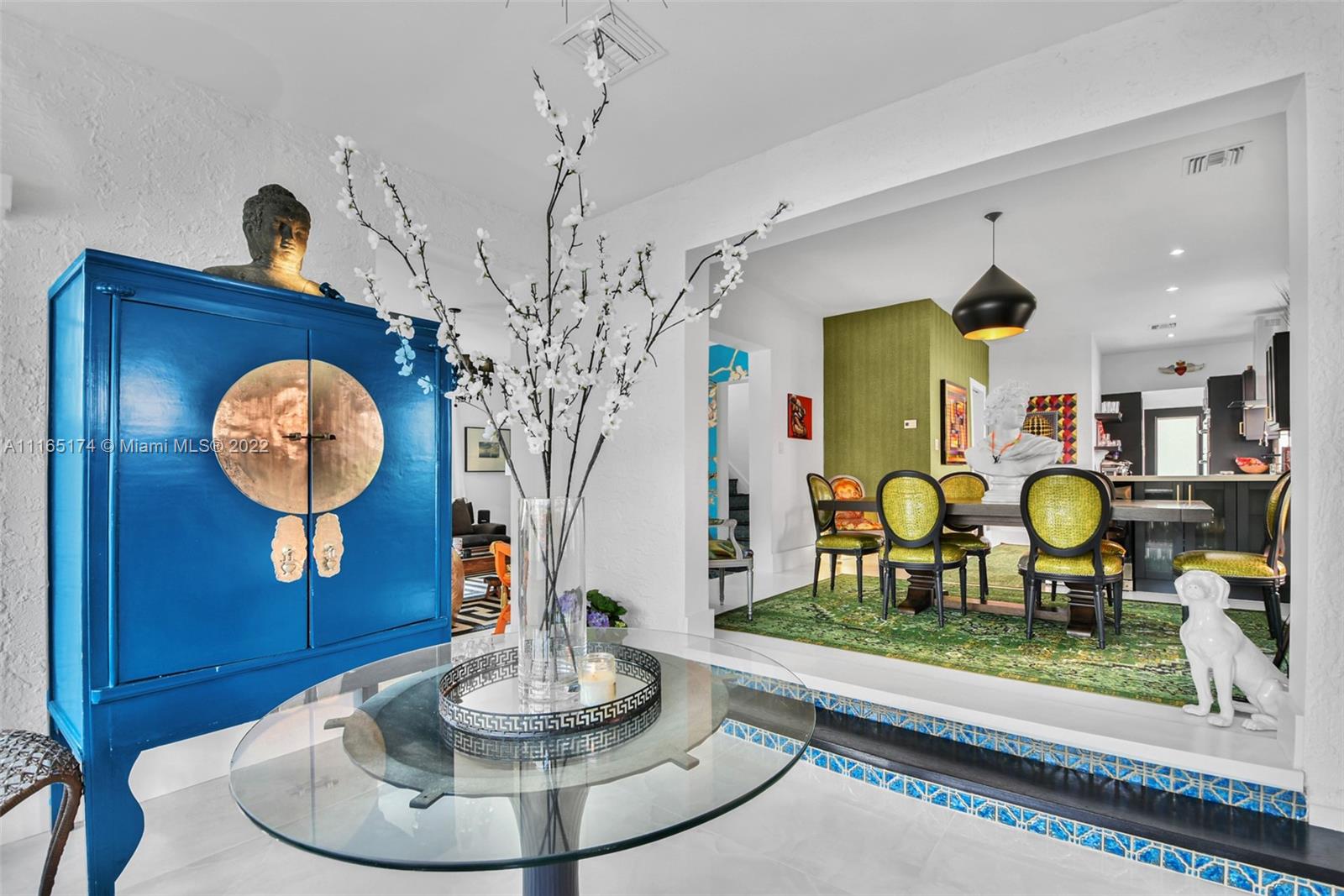 4722 Southwest 5th Street Miami, FL 33134 - Photo 5 of 36 a living room with couch and a chandelier