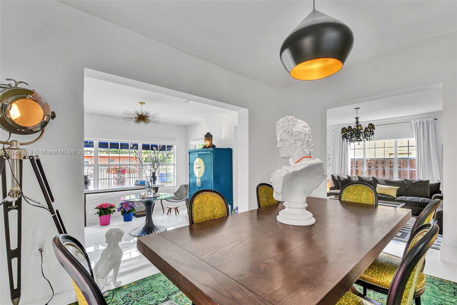4722 Southwest 5th Street Miami, FL 33134 - Photo 7 of 36 a view of a dining room with furniture and chandelier