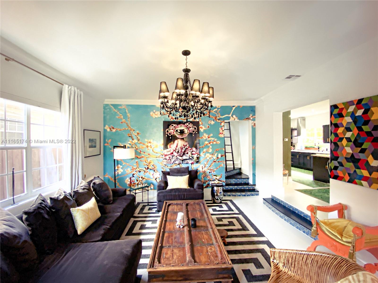 4722 Southwest 5th Street Miami, FL 33134 - Photo 8 of 36 a living room with furniture and a chandelier