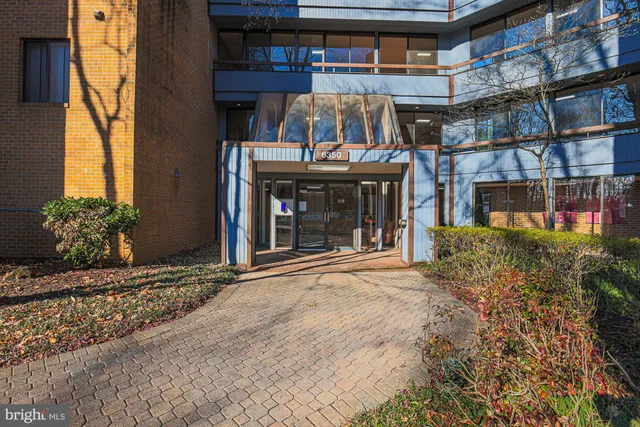 a front view of a building with garden