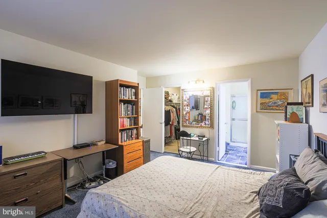 a bedroom with a bed and a television in it