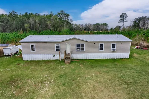 a aerial view of a house and a yard