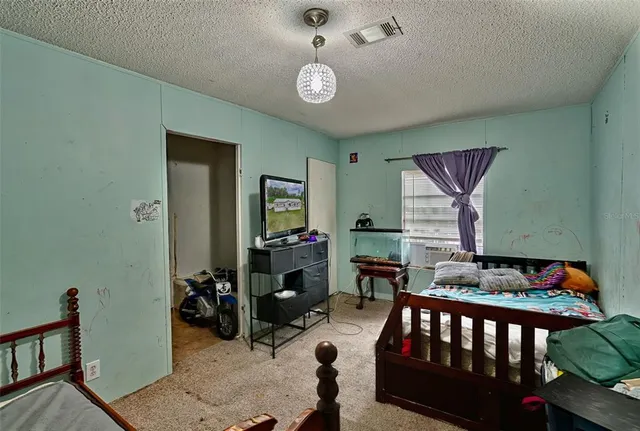 a bedroom with furniture and a window