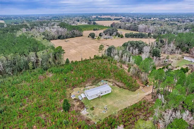 an aerial view of residential house with outdoor space