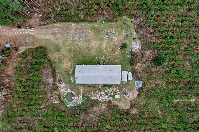an aerial view of residential houses with outdoor and green space