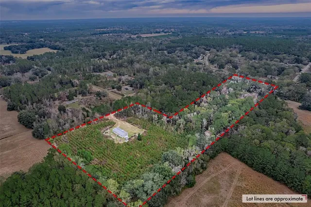 an aerial view of residential house and outdoor space