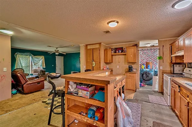 a view of a living room and a kitchen