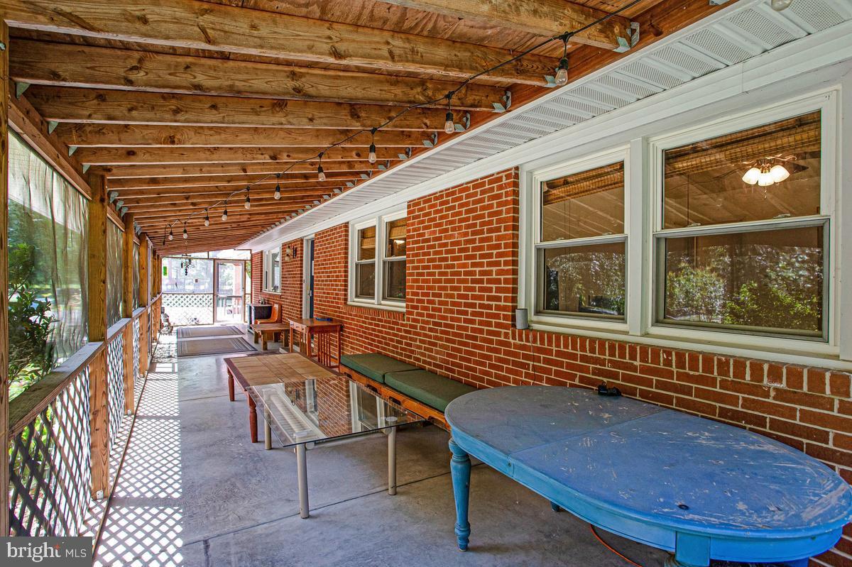 6600 Ashland Road La Plata, MD 20646 - Photo 28 of 40 a balcony with furniture and a potted plant