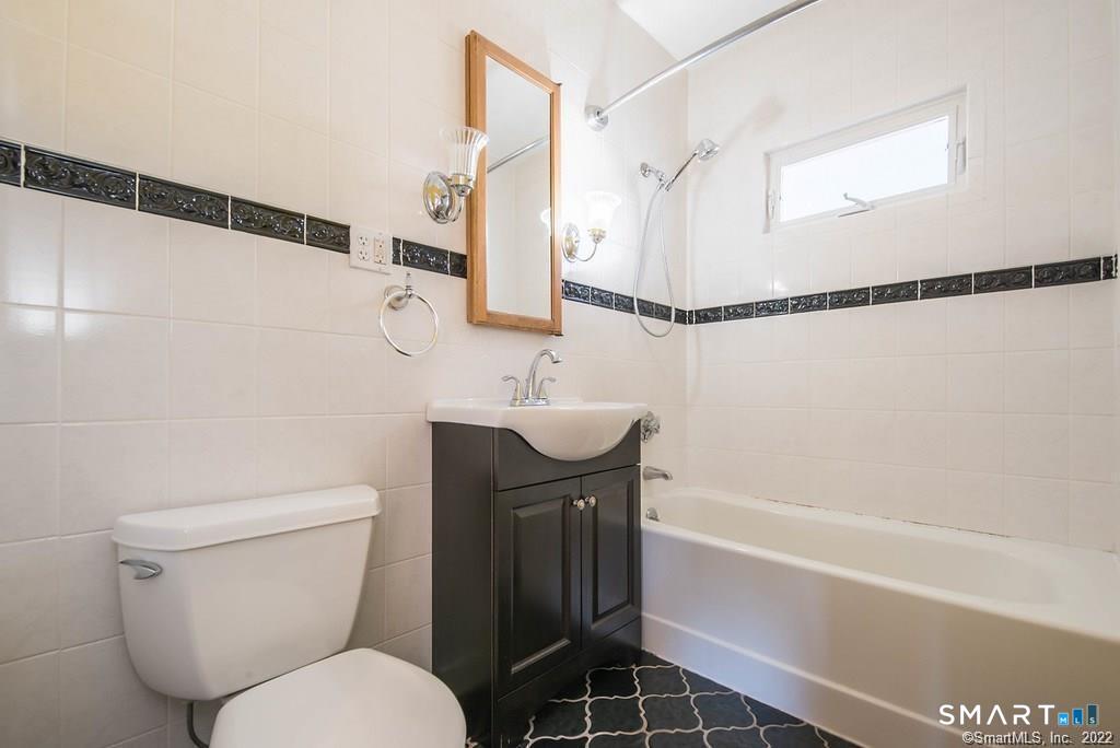 2 Pleasant Street, Unit 2 Windsor Locks, CT 06096 - Photo 11 of 11 a bathroom with a sink a toilet and shower