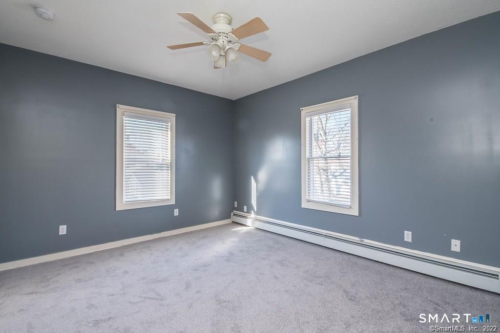 2 Pleasant Street, Unit 2 Windsor Locks, CT 06096 - Photo 9 of 11 a view of an empty room with a window