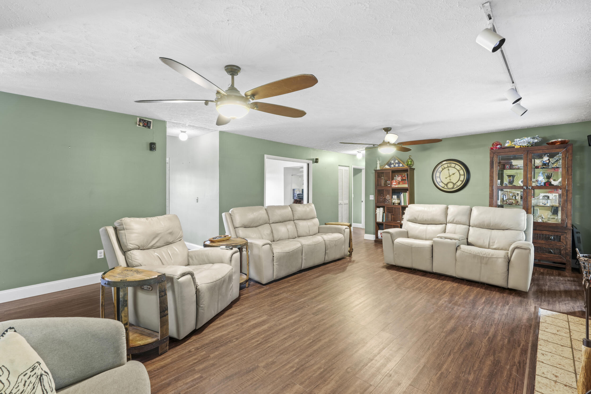 4170 McCarty Road Fort Pierce, FL 34945 - Photo 18 of 57 a living room with furniture and wooden floor