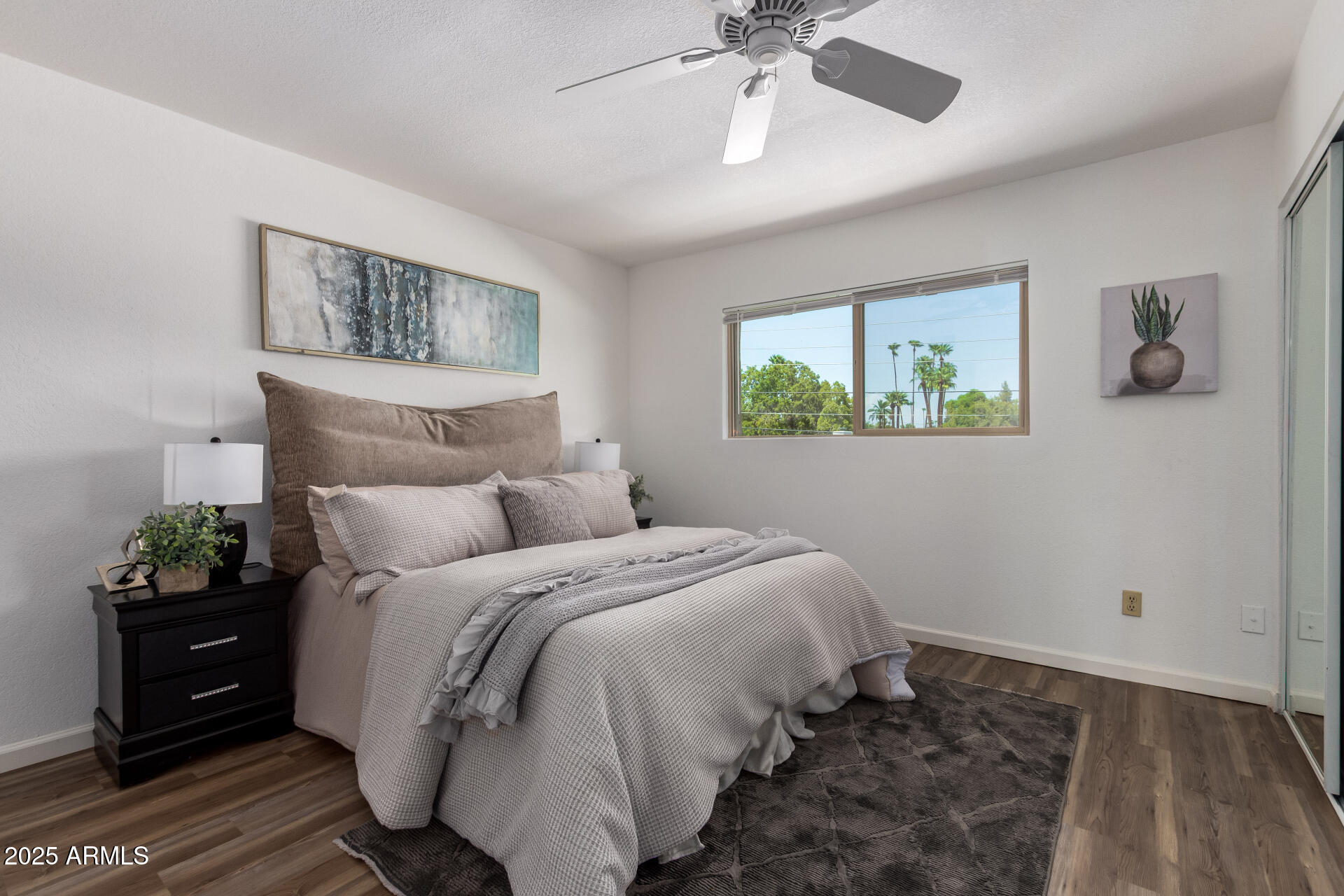 7430 East Chaparral Road, Unit 245A Scottsdale, AZ 85250 - Photo 14 of 30 a bedroom with bed and wooden floor