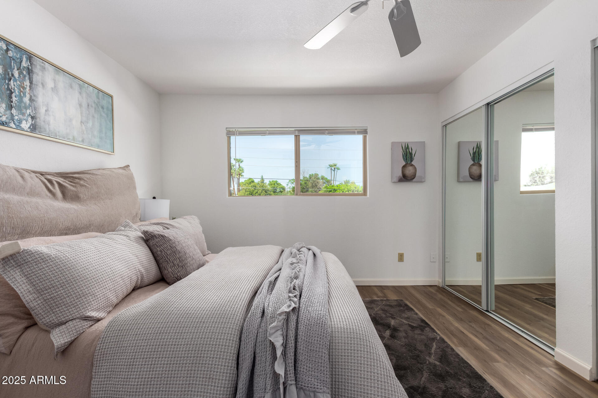 7430 East Chaparral Road, Unit 245A Scottsdale, AZ 85250 - Photo 15 of 30 a bedroom with furniture and a rug