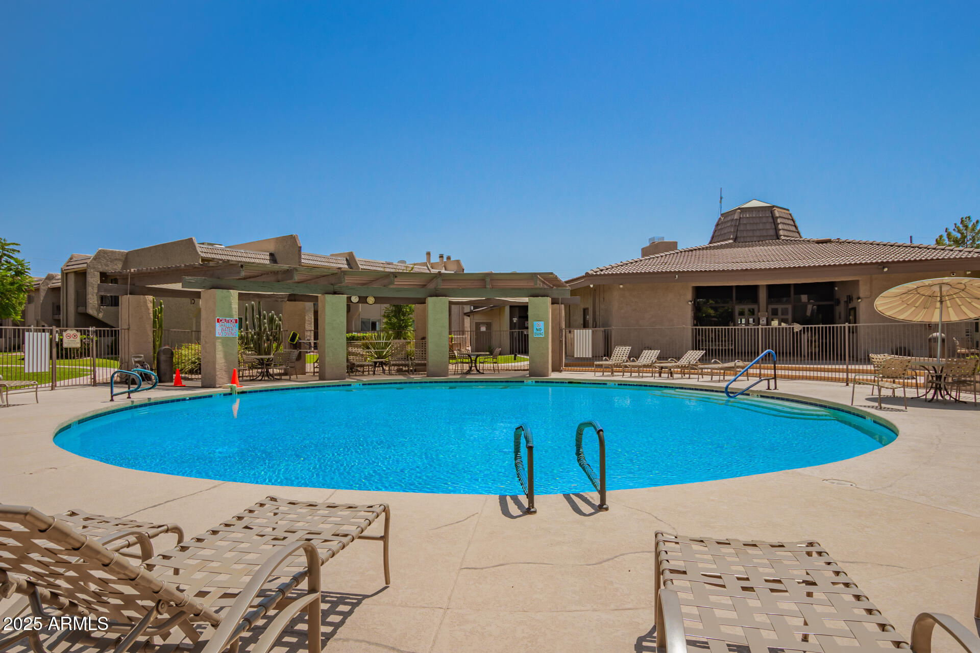 7430 East Chaparral Road, Unit 245A Scottsdale, AZ 85250 - Photo 23 of 30 a view of house with a swimming pool