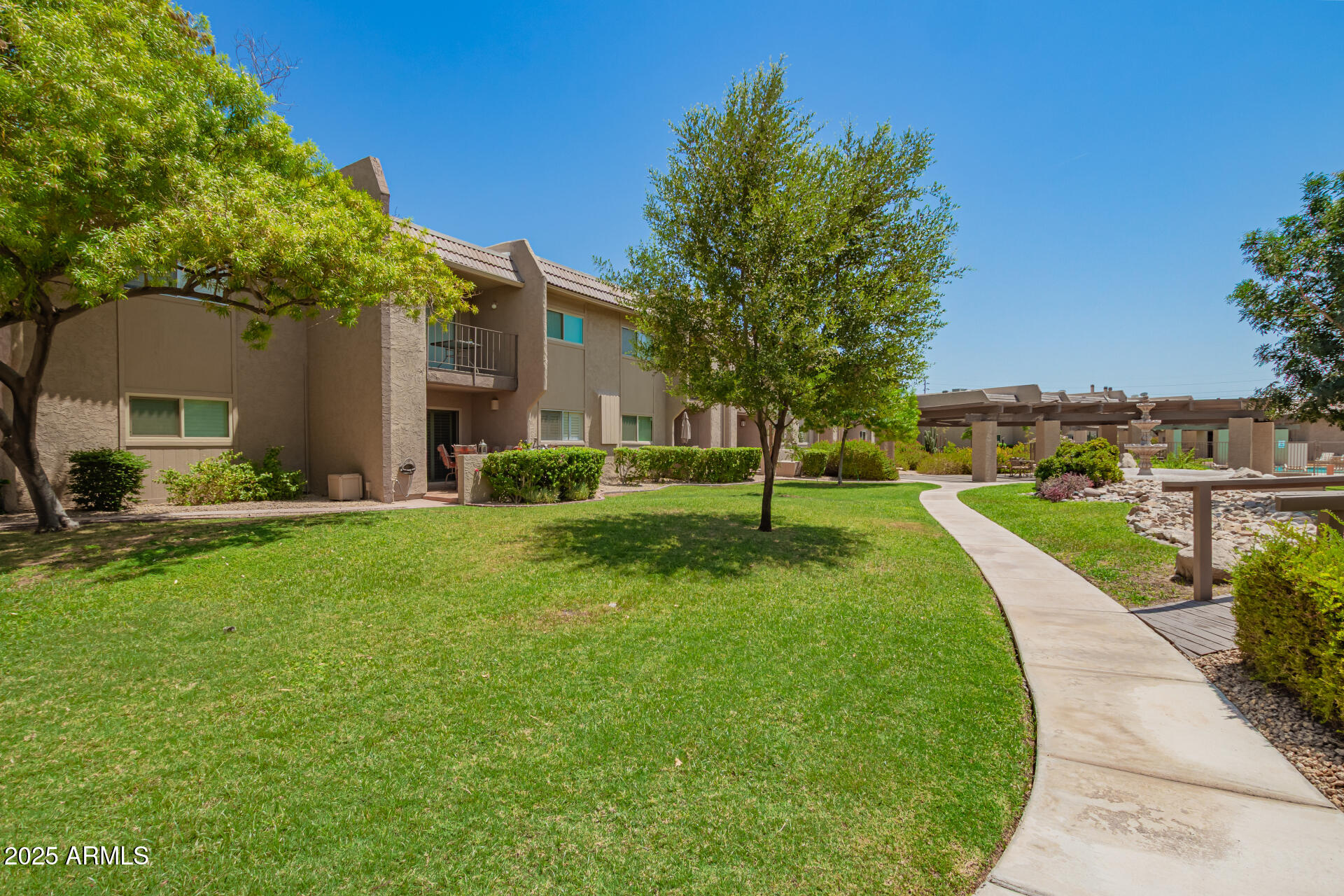 7430 East Chaparral Road, Unit 245A Scottsdale, AZ 85250 - Photo 29 of 30 a view of a house with a yard