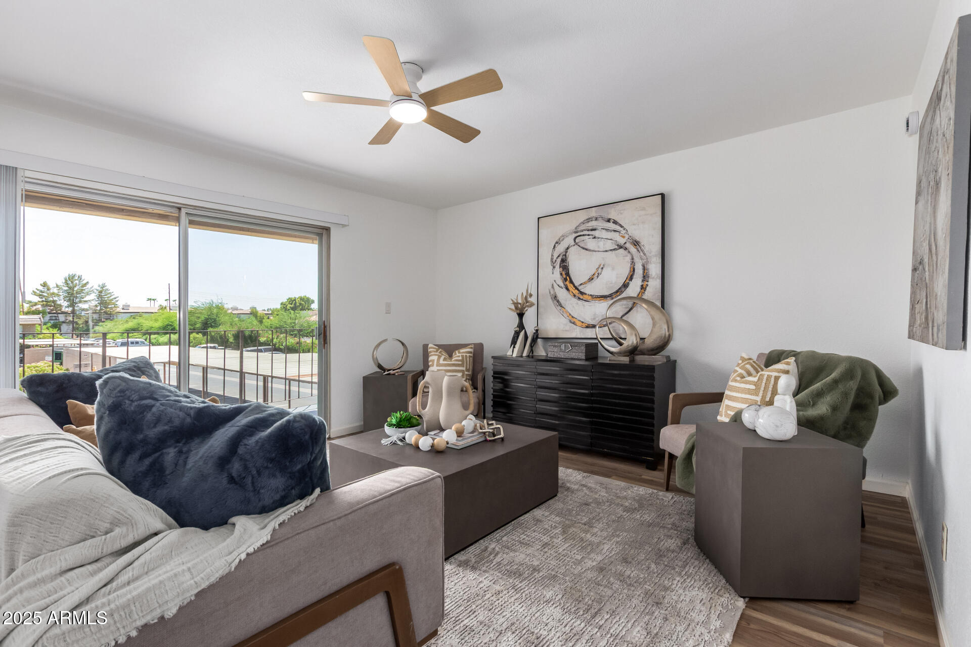 7430 East Chaparral Road, Unit 245A Scottsdale, AZ 85250 - Photo 3 of 30 a living room with furniture and a floor to ceiling window