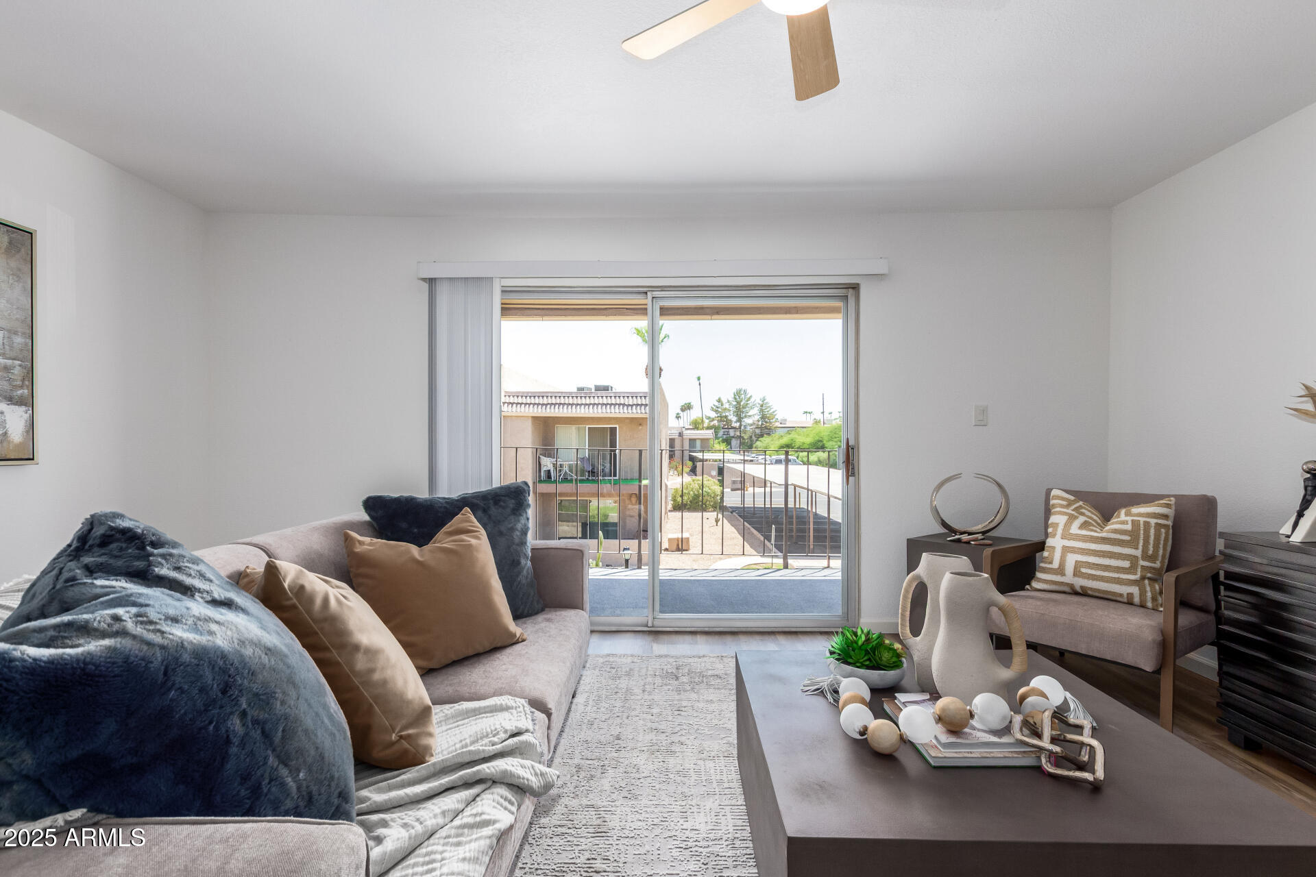 7430 East Chaparral Road, Unit 245A Scottsdale, AZ 85250 - Photo 4 of 30 a bedroom with furniture and a large window