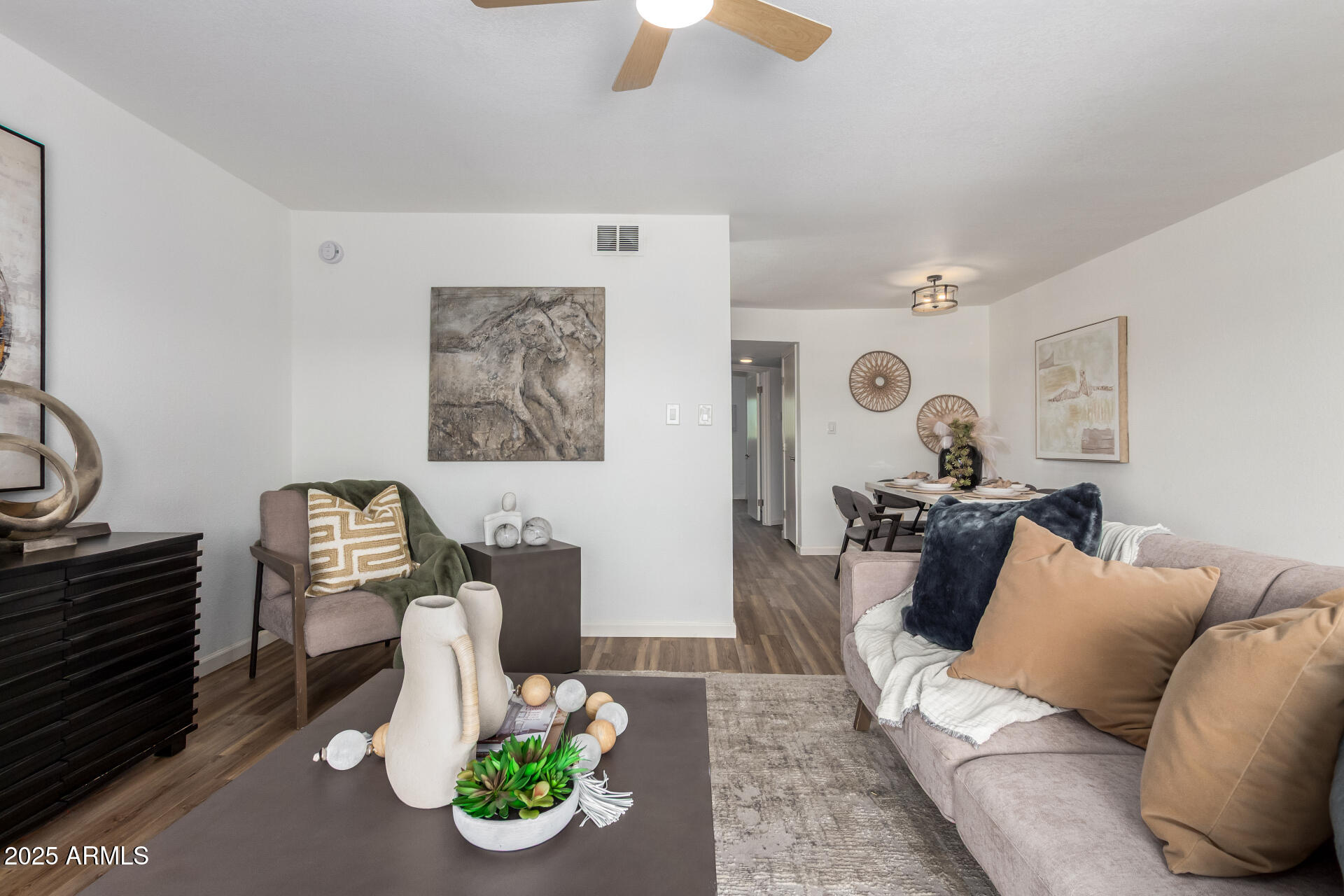 7430 East Chaparral Road, Unit 245A Scottsdale, AZ 85250 - Photo 6 of 30 a living room with furniture and a chandelier