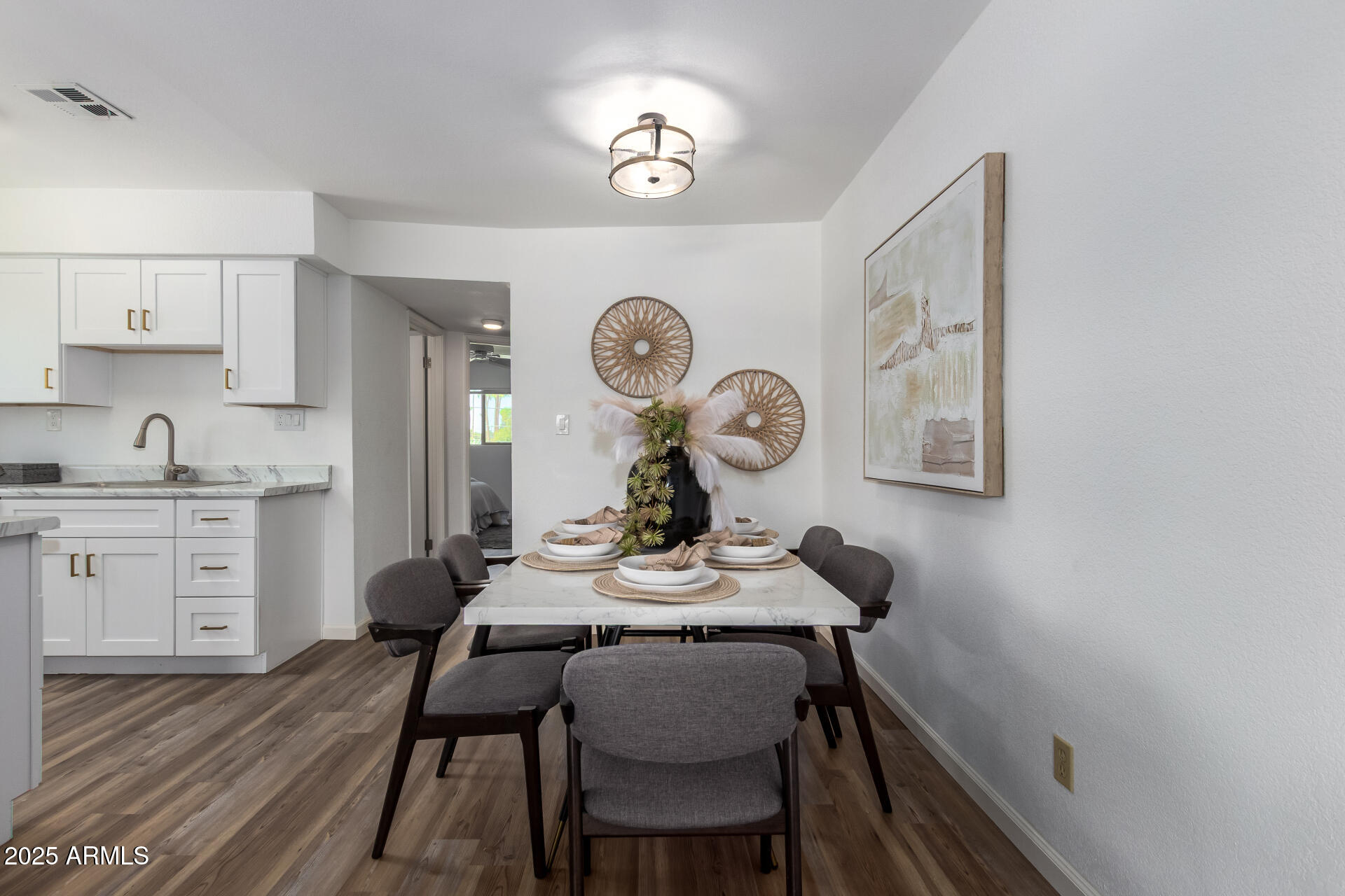 7430 East Chaparral Road, Unit 245A Scottsdale, AZ 85250 - Photo 8 of 30 a view of a dining room with furniture and wooden floor