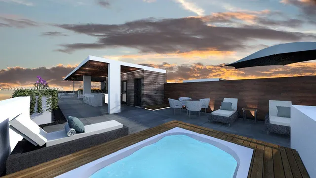 a kitchen with stainless steel appliances kitchen island granite countertop a table and chairs