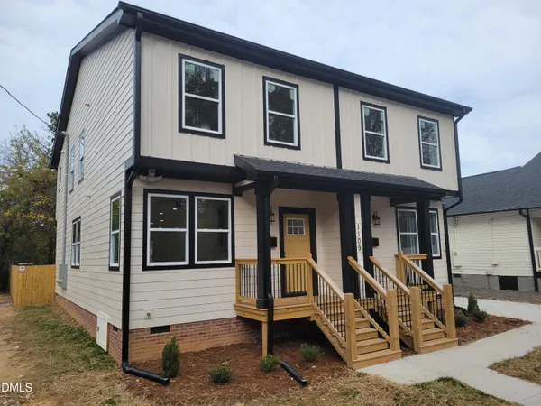 a front view of a house with stairs