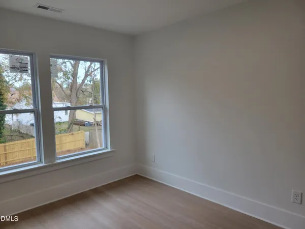 a bath room with a sink a toilet and a bath tub