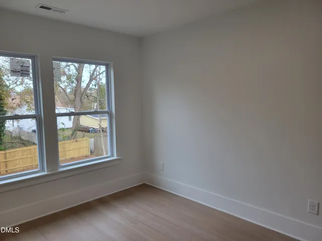 a bath room with a sink a toilet and a bath tub