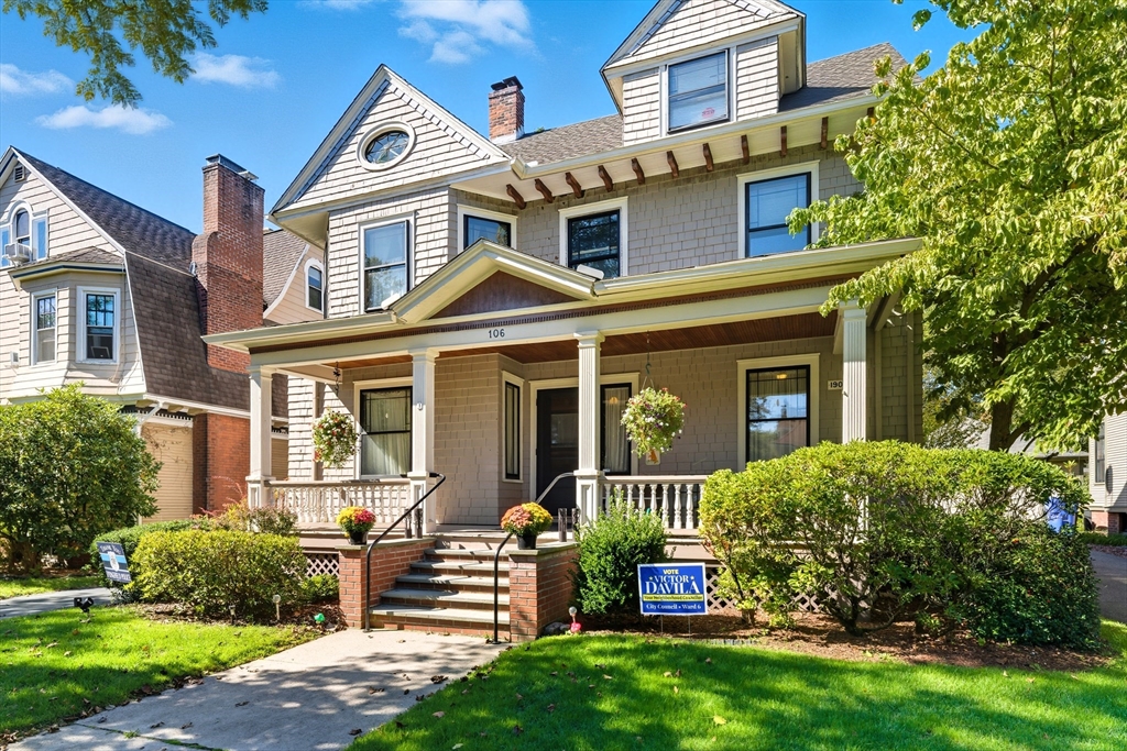 front view of a house with a yard