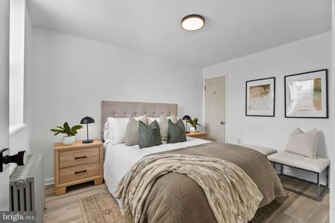 a bedroom with a bed and a couch