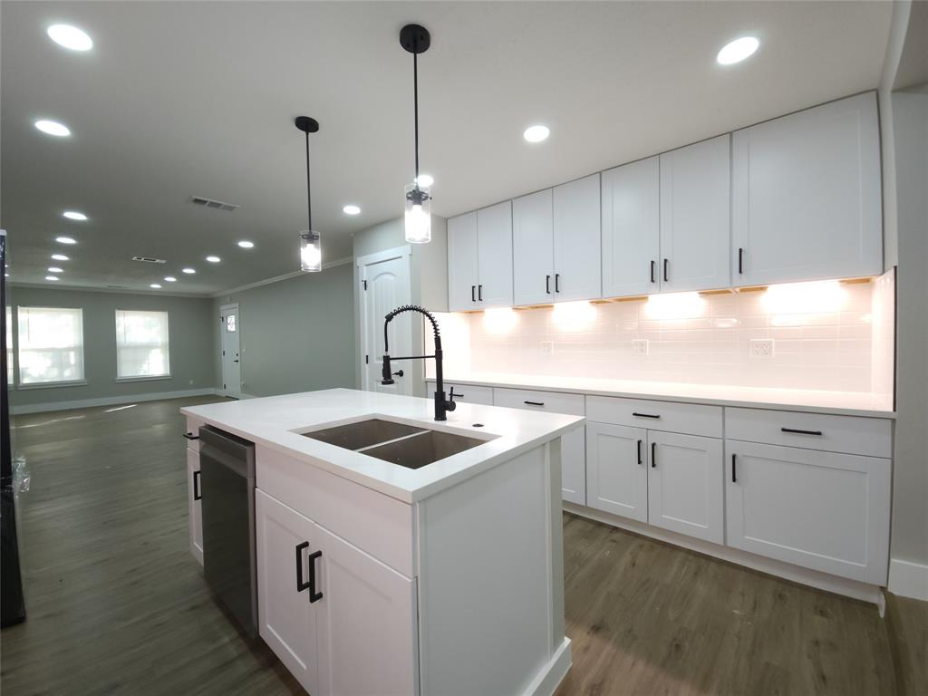 7039 Bates Street Dallas, TX 75227 - Photo 11 of 40 a kitchen with sink and cabinets