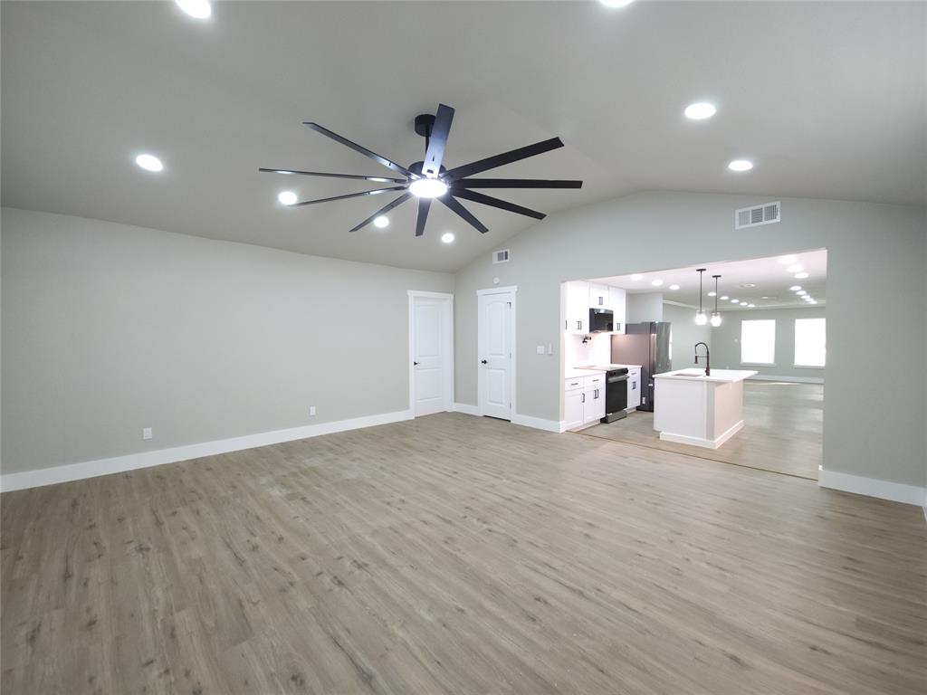 7039 Bates Street Dallas, TX 75227 - Photo 18 of 40 a view of a livingroom with a kitchen