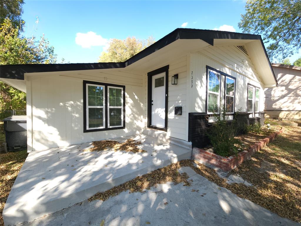 7039 Bates Street Dallas, TX 75227 - Photo 2 of 40 a view of a house with backyard
