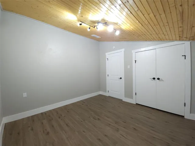 a view of room with wooden floor