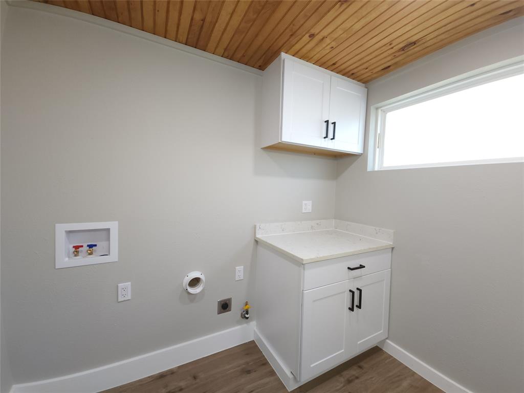 7039 Bates Street Dallas, TX 75227 - Photo 39 of 40 a room with storage and utility