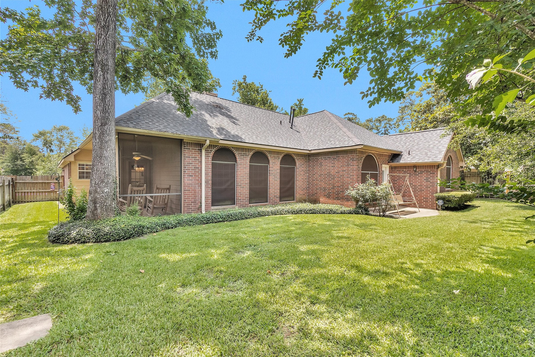 529 Stephen F Austin Drive Conroe, TX 77302 - Photo 11 of 37 a front view of a house with a yard