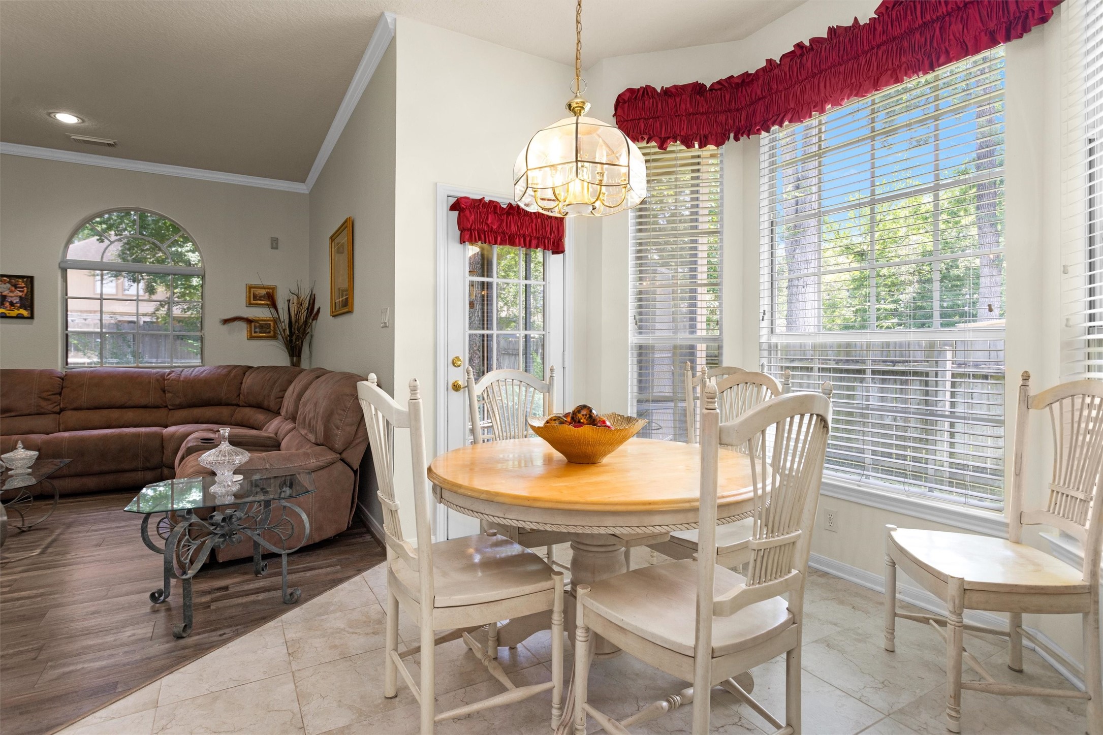 529 Stephen F Austin Drive Conroe, TX 77302 - Photo 17 of 37 a dining room with furniture and a large window