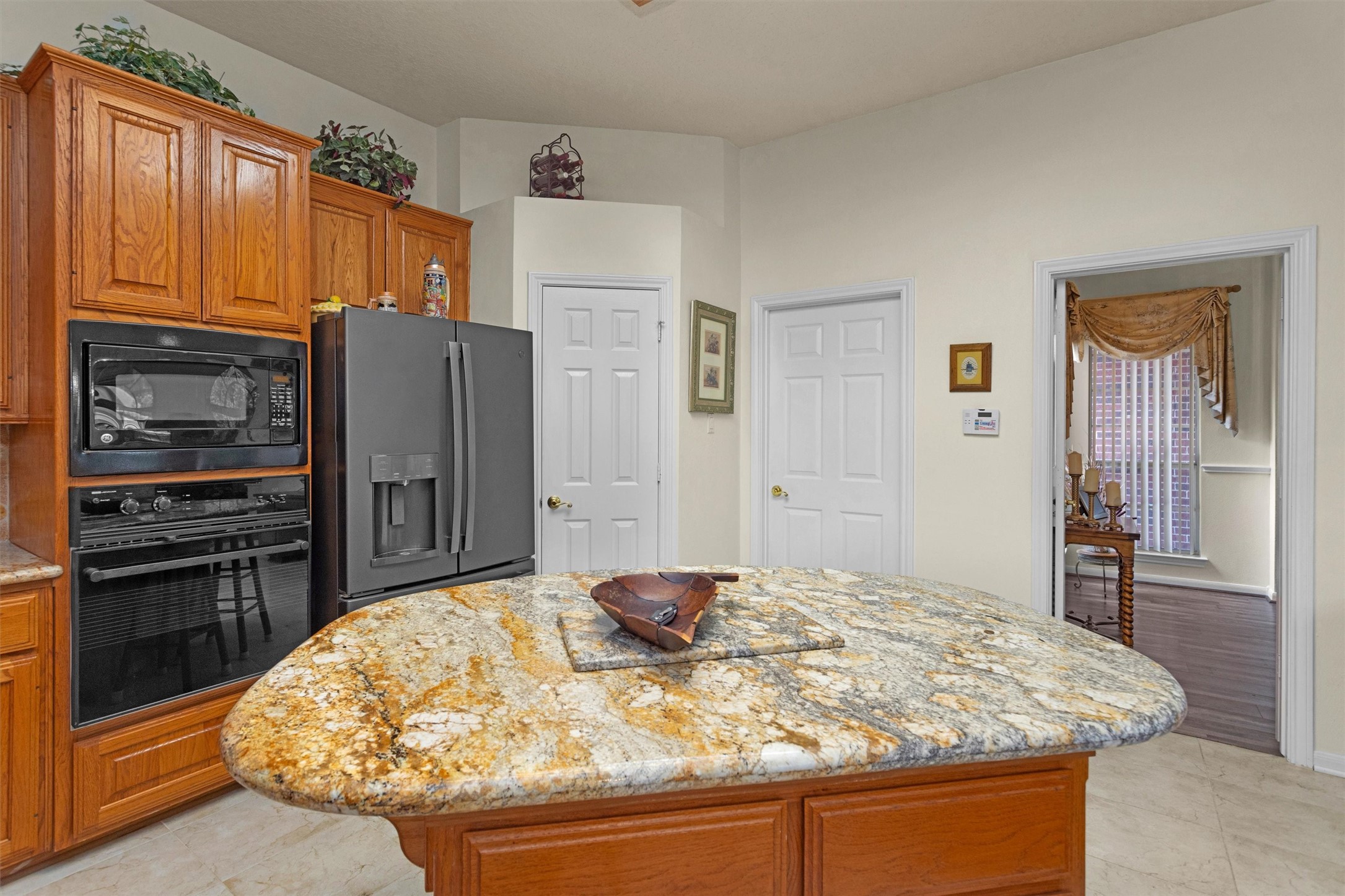529 Stephen F Austin Drive Conroe, TX 77302 - Photo 20 of 37 a kitchen with stainless steel appliances granite countertop a refrigerator and a stove top oven