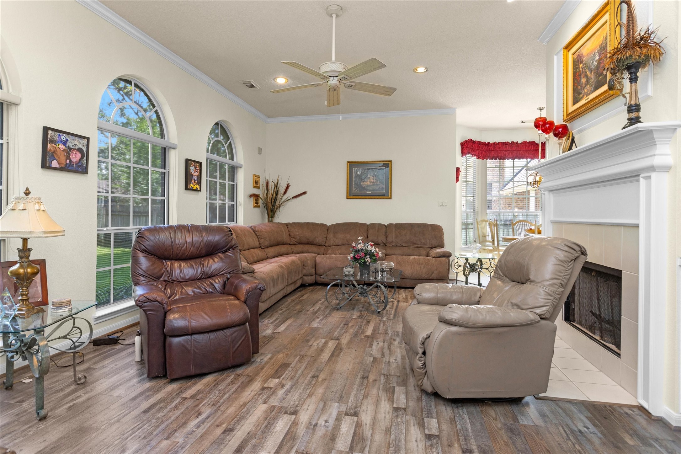529 Stephen F Austin Drive Conroe, TX 77302 - Photo 24 of 37 a living room with furniture a fireplace and a large window