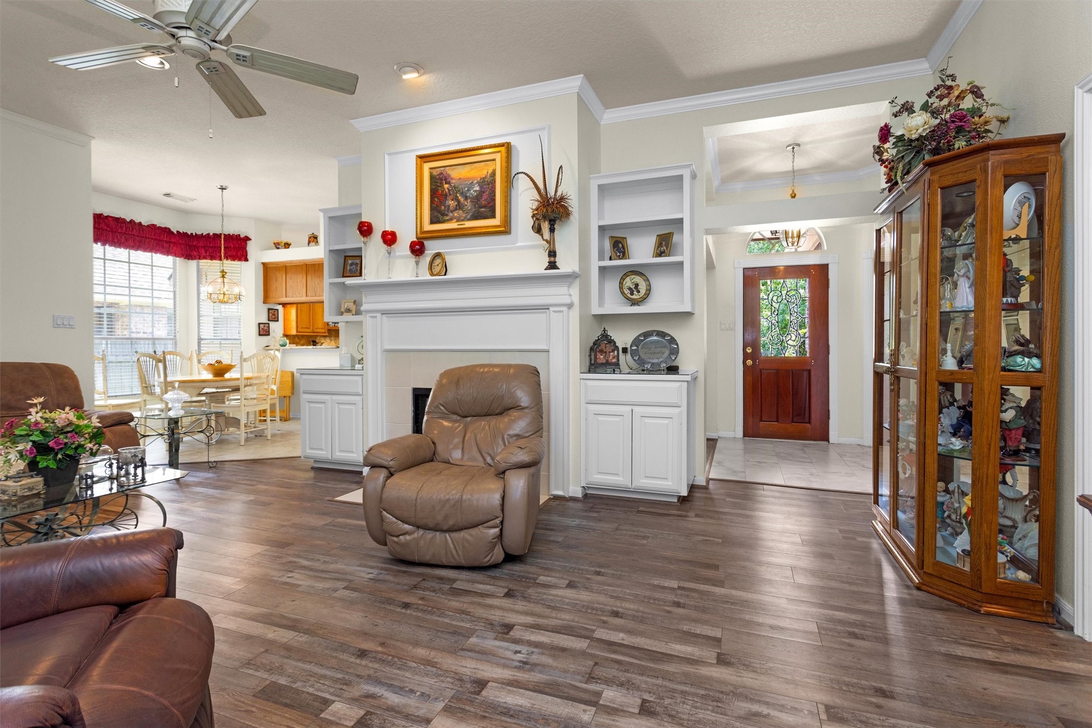 529 Stephen F Austin Drive Conroe, TX 77302 - Photo 26 of 37 a living room with furniture and a fireplace