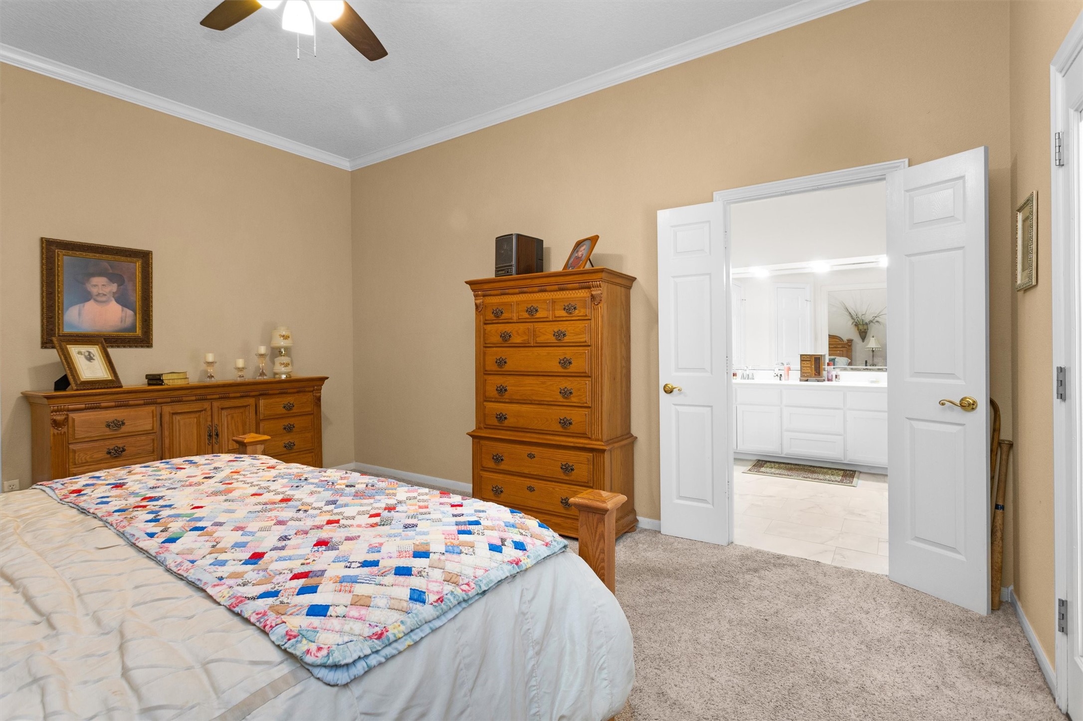 529 Stephen F Austin Drive Conroe, TX 77302 - Photo 27 of 37 a bedroom with a bed and a dresser