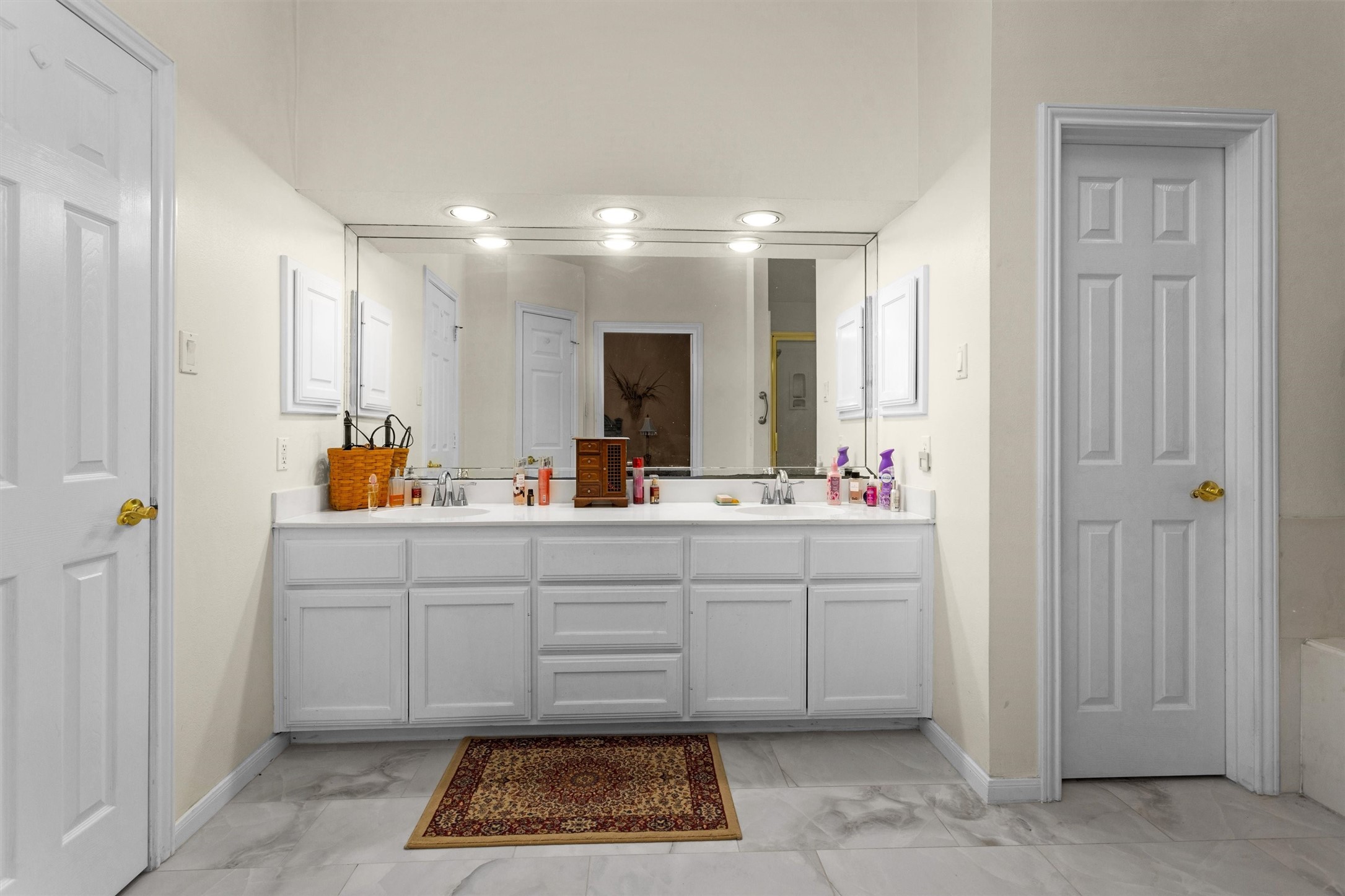 529 Stephen F Austin Drive Conroe, TX 77302 - Photo 31 of 37 a spacious bathroom with a double vanity sink and a mirror