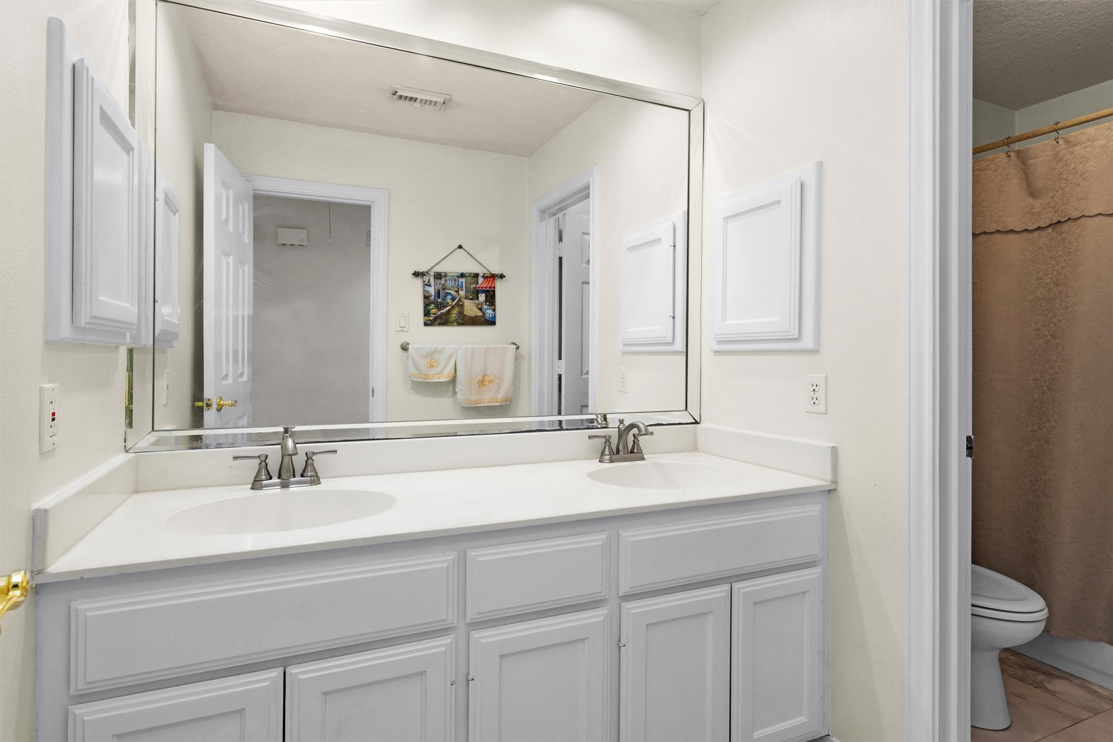 529 Stephen F Austin Drive Conroe, TX 77302 - Photo 33 of 37 a bathroom with a sink and a mirror